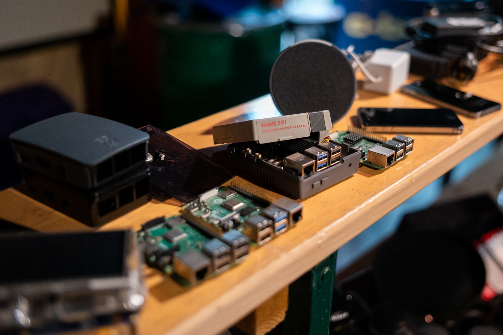 A close up photo of Raspberry Pi computers, one is inside of a NES inspired case