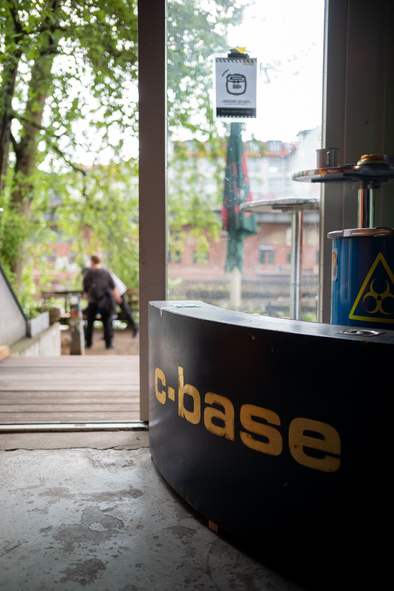 A view outside of c-base, there is a corner seat with the c-base name on it